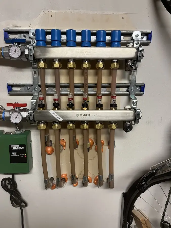 Plumber performing Water Heater Repair at a residential property in Breitung